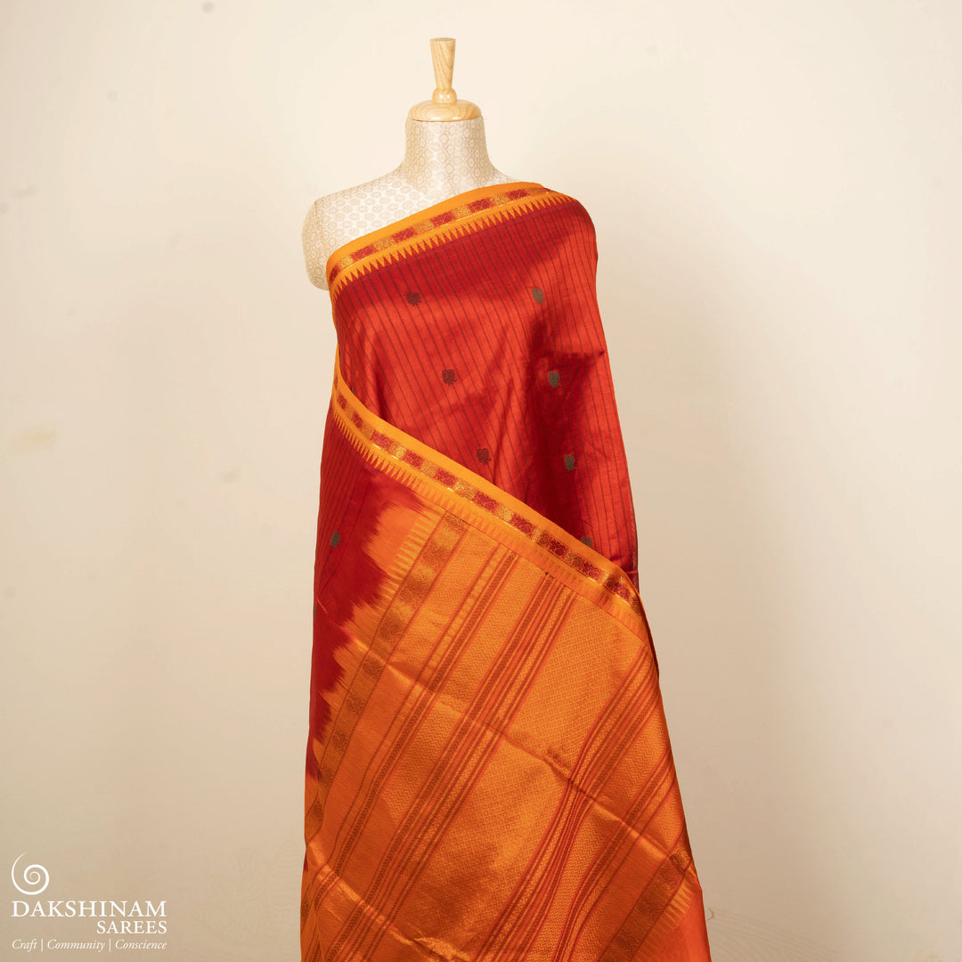 Orange handwoven silk cotton saree with yellow temple border, annam motifs and traditional pallu