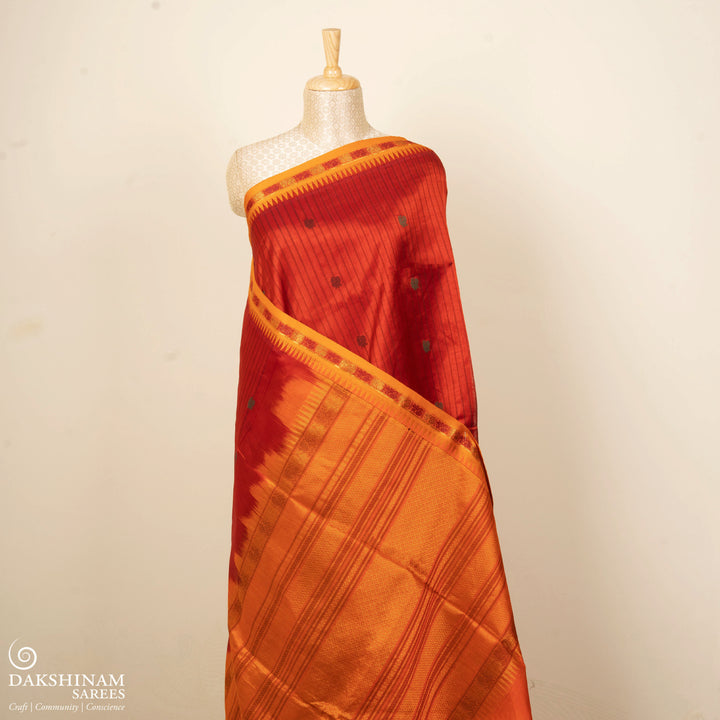 Orange handwoven silk cotton saree with yellow temple border, annam motifs and traditional pallu