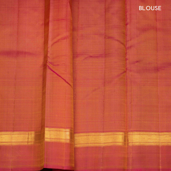 Yellow handwoven Kanjivaram silk saree with pink border, gold zari and contrast pallu