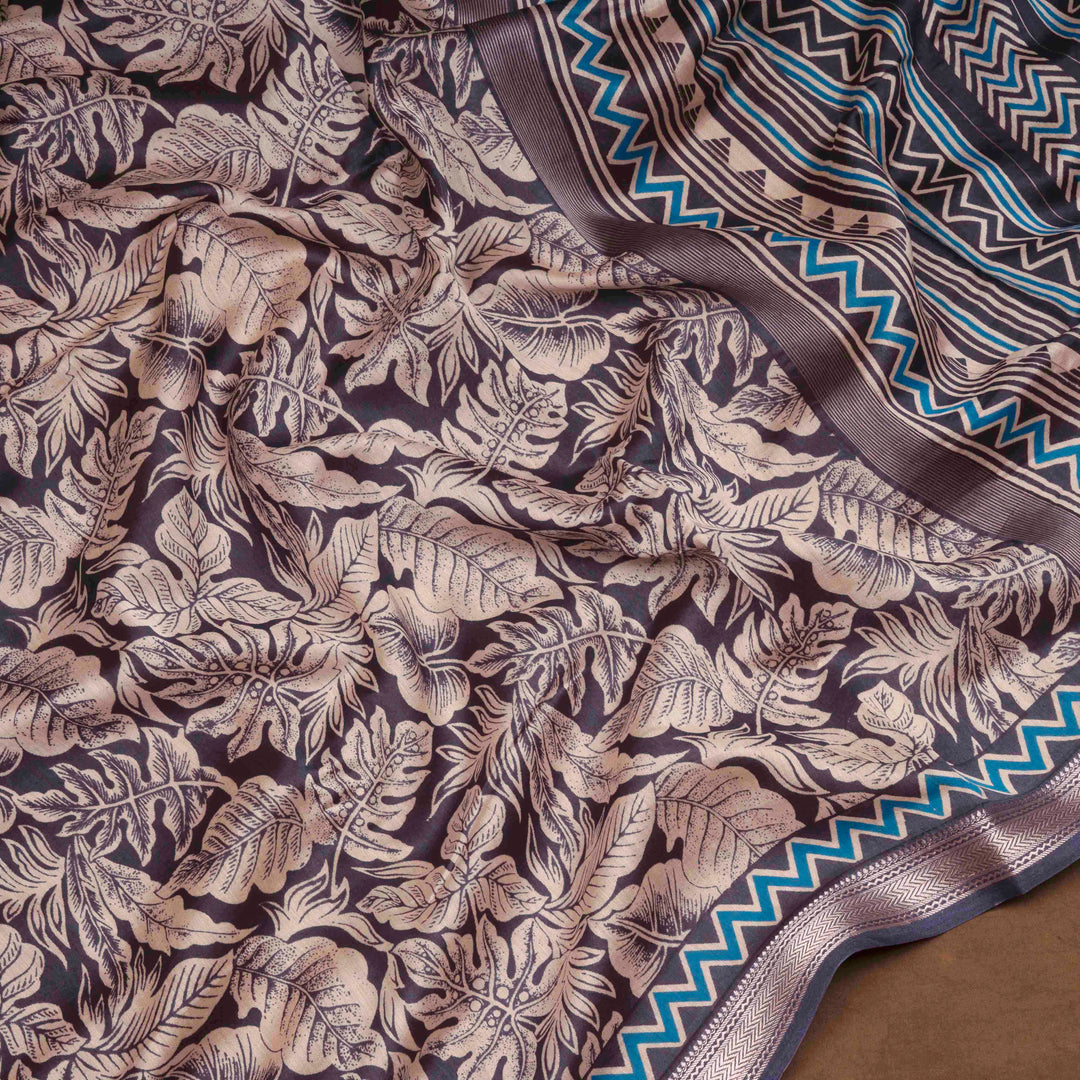 Dark blue Chanderi silk cotton saree with white leaf print, silver zari border and striped pallu