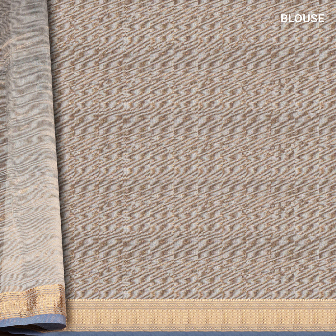 Ice blue Chanderi silk cotton saree with gold zari geometric patterns and embroidered lace border
