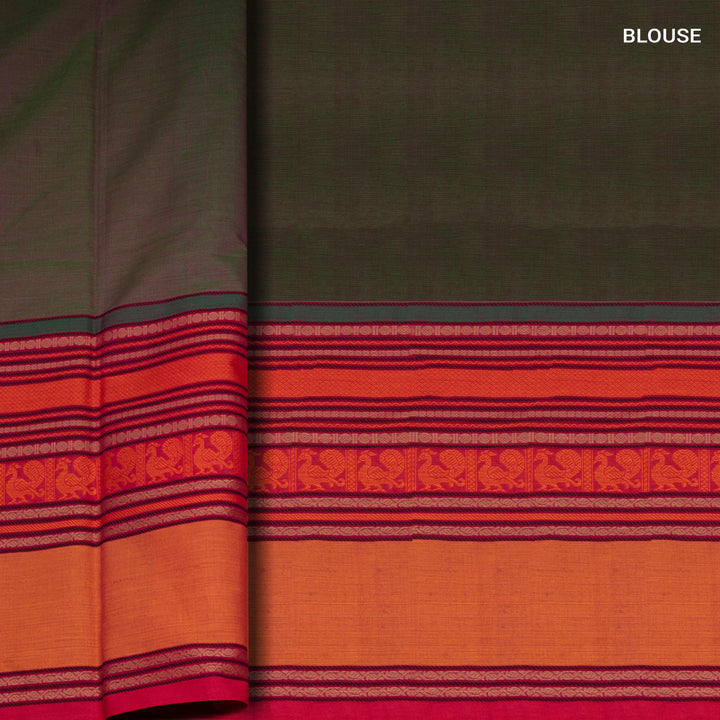 Green handwoven cotton saree with orange and brown border, peacock motifs and traditional pallu
