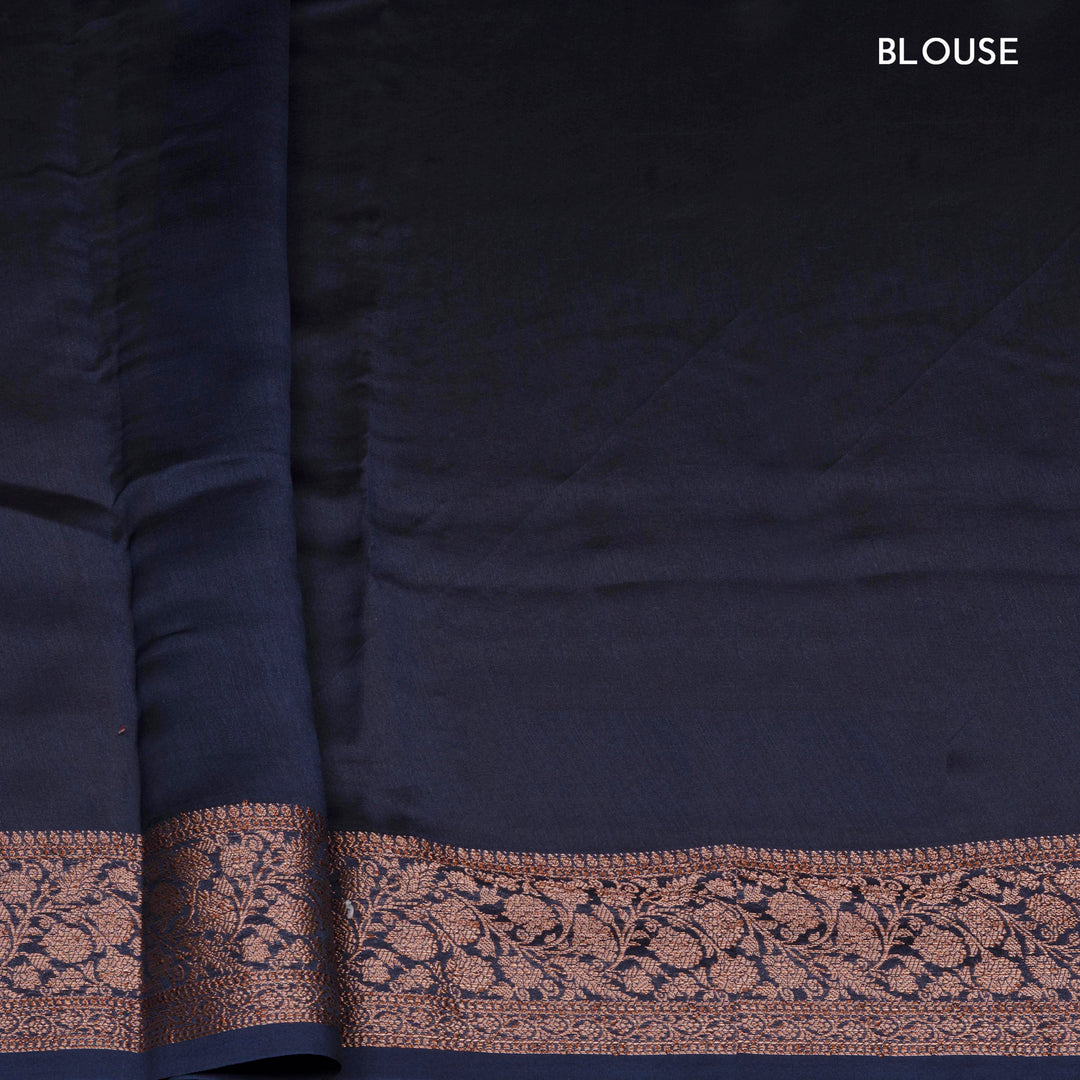Dark blue Chanderi silk cotton saree with white lotus floral print, silver zari border and striped pallu