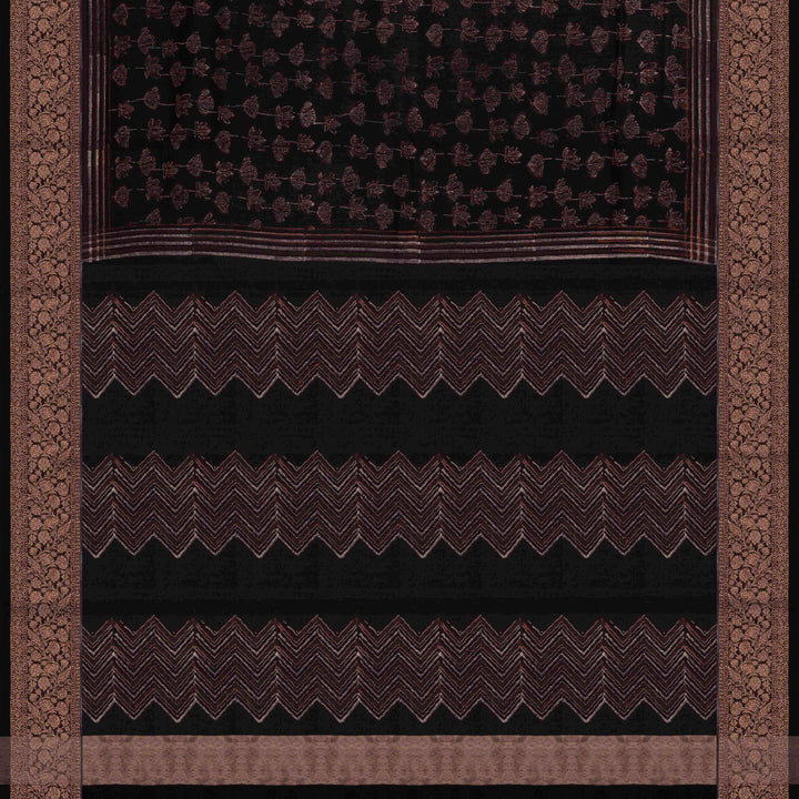 Black Chanderi silk cotton saree with white lotus floral print, gold zari border and orange striped pallu