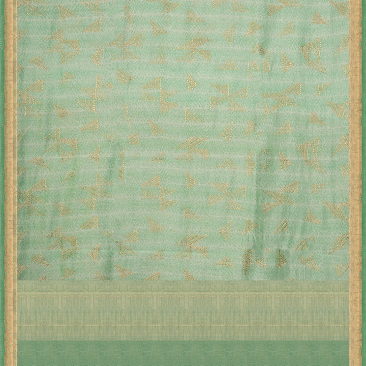 Green Chanderi silk cotton saree with gold zari geometric patterns and embroidered lace border