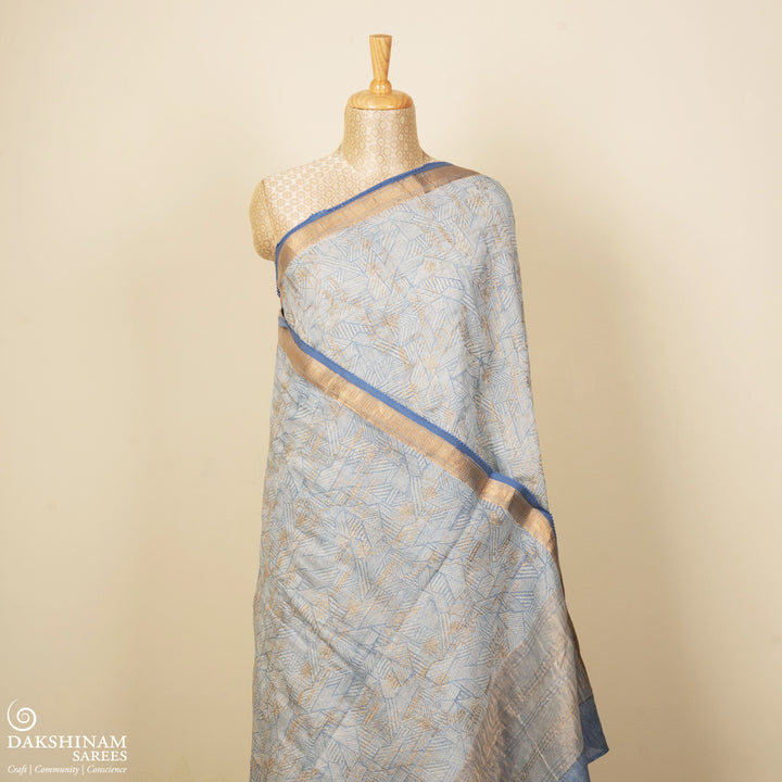 Ice blue Chanderi silk cotton saree with gold zari geometric patterns and embroidered lace border