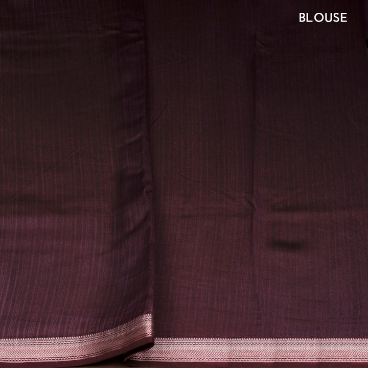 Violet Chanderi silk cotton saree with white leaf print, silver zari border and striped pallu