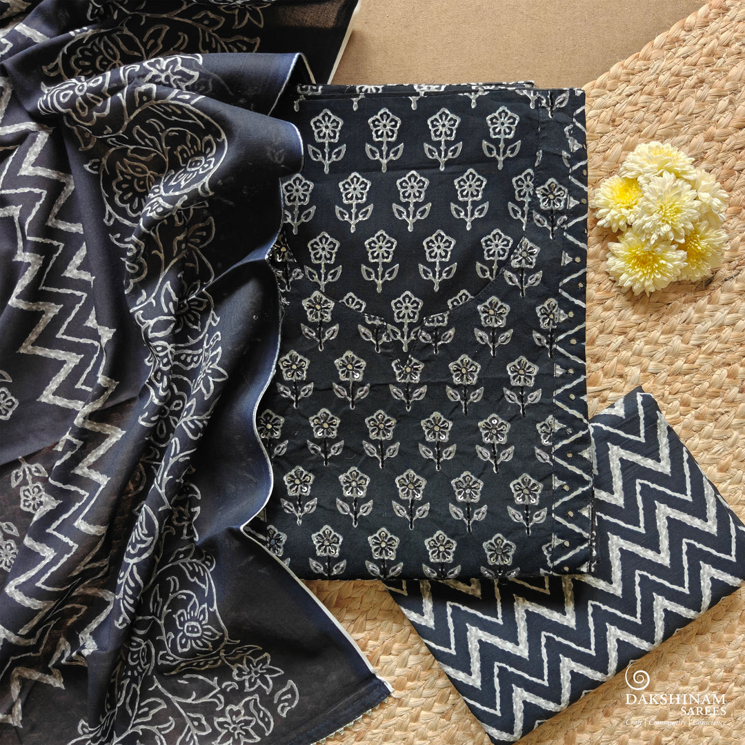 Black three-piece suit set with floral buttas, sequin neckline and chevron detailing