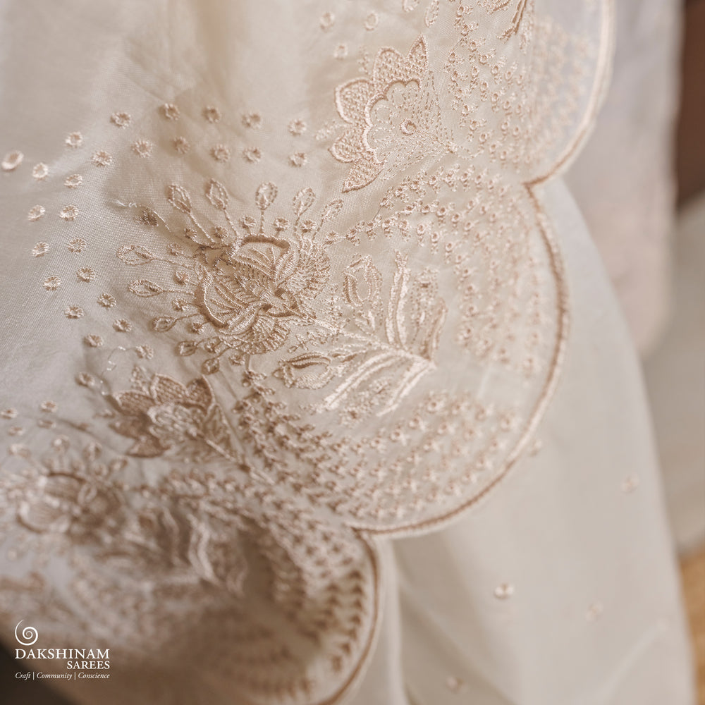 Closeuup of Handwoven White embroidered organza silk Saree